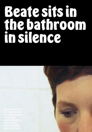 Beate sits in the bathroom in silence